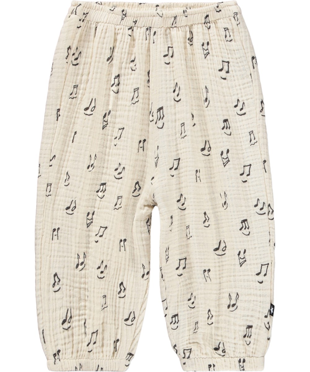 Serene - Happy Notes - Soft, cream-coloured trousers for the little ones made organic cotton with a music print 
