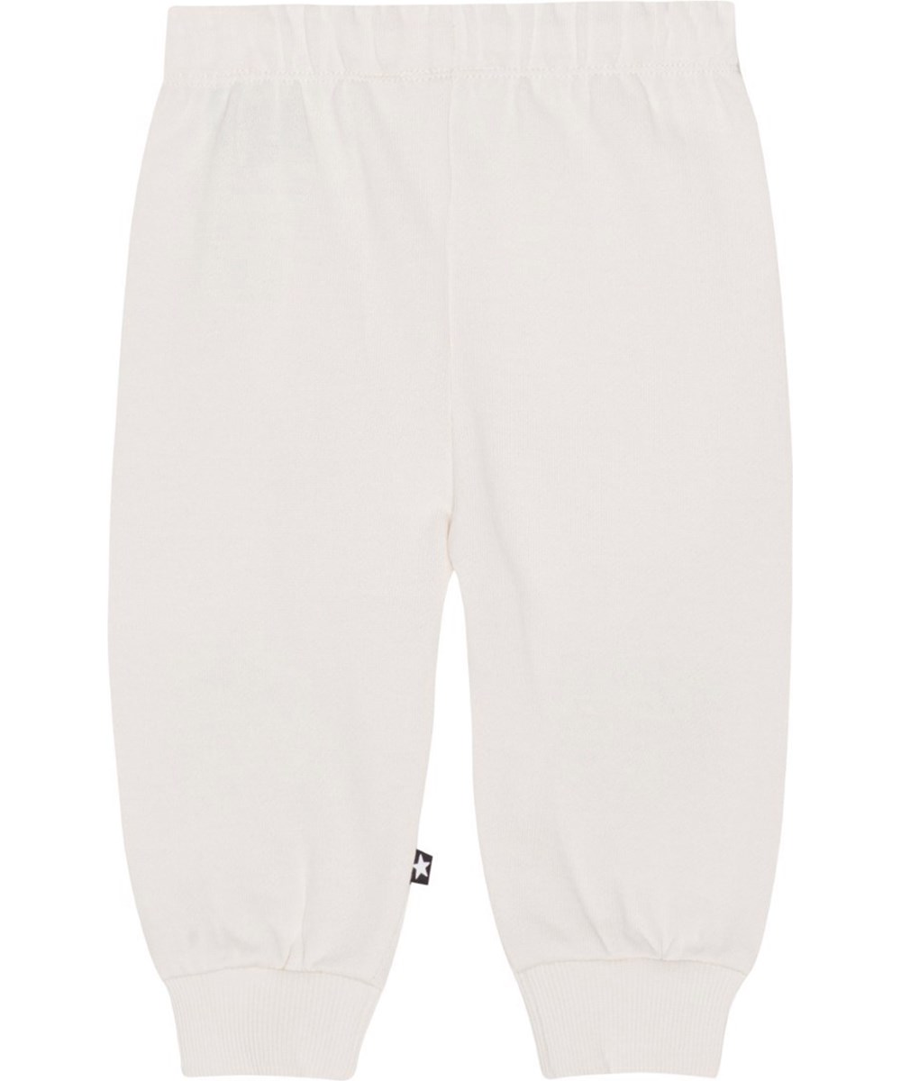 Simeon - Blue Heart - Off-white sweatpants with a print of blue smiling hearts on the knees in organic cotton