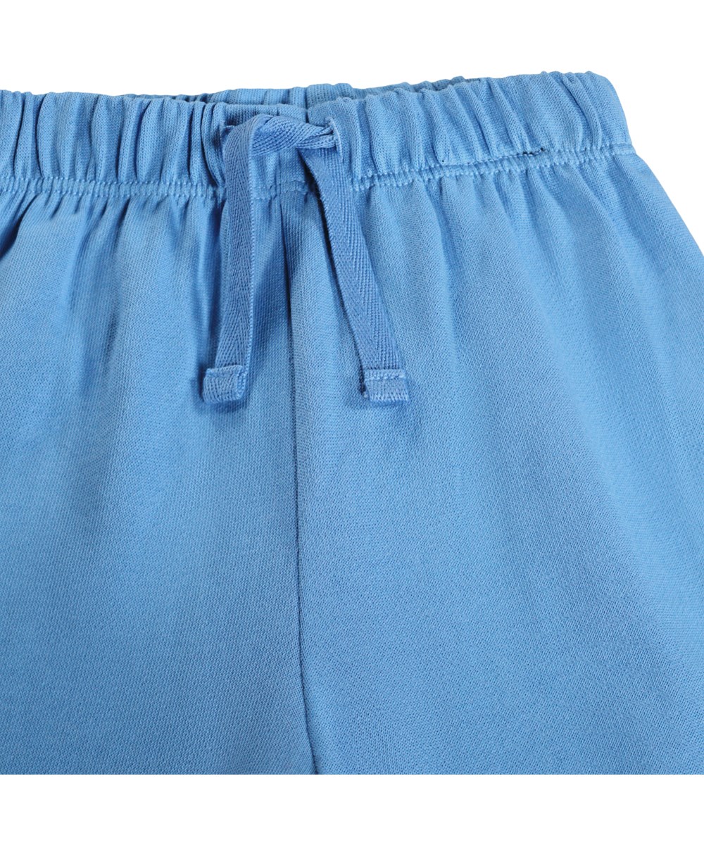 Simeon - Blue Tide - Soft, blue sweatpants for the little ones made of organic cotton with funny knee patches