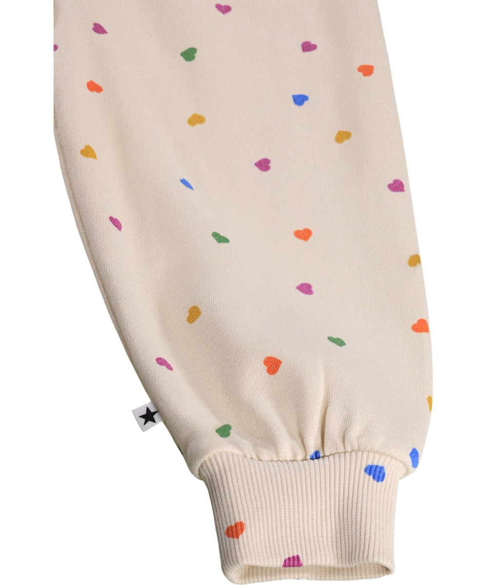 Simeon - Confetti_Rainbow - Soft, white sweatpants for the little ones made of organic cotton witha heart print