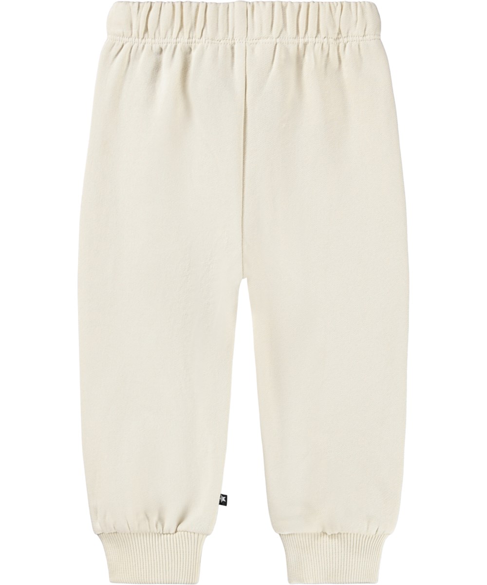 Simeon - Croco-Phant - Soft off-white pants for the little ones made of organic cotton with a handprint of colorful animals.