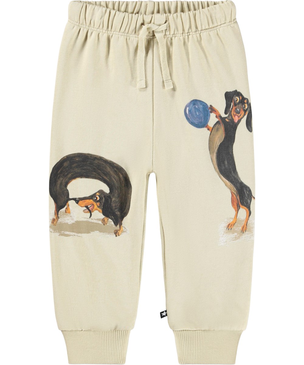Simeon - Dog Play - Soft beige pants for the little ones made of organic cotton with a dachshund print.