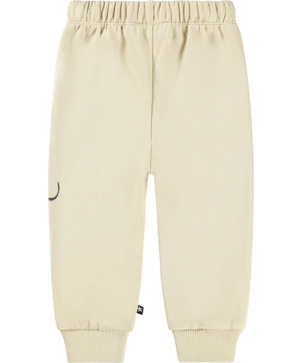Simeon - Dog Play - Soft beige pants for the little ones made of organic cotton with a dachshund print.