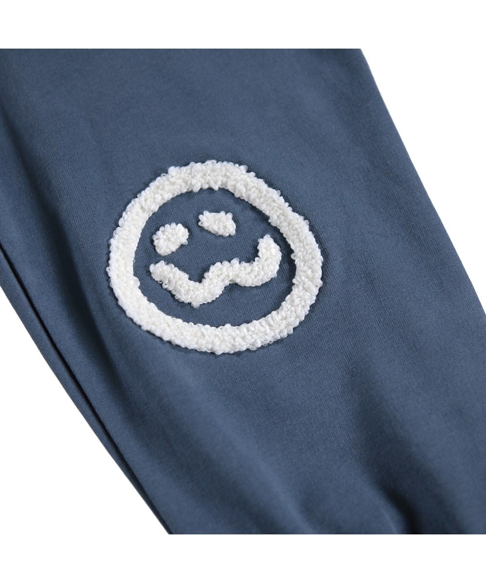 Simeon - Evening Sky - Soft dark blue pants for the little ones made of organic cotton with soft white faces on knees.