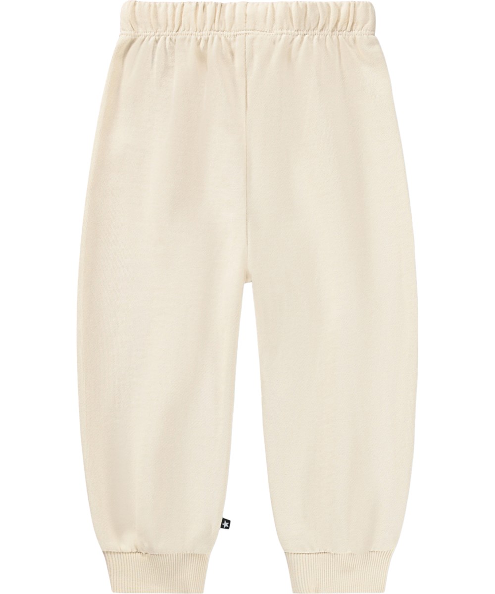 Simeon - Little Rainbow - Soft, cream-coloured sweatpants for the little ones made of organic cotton with a rainbow print