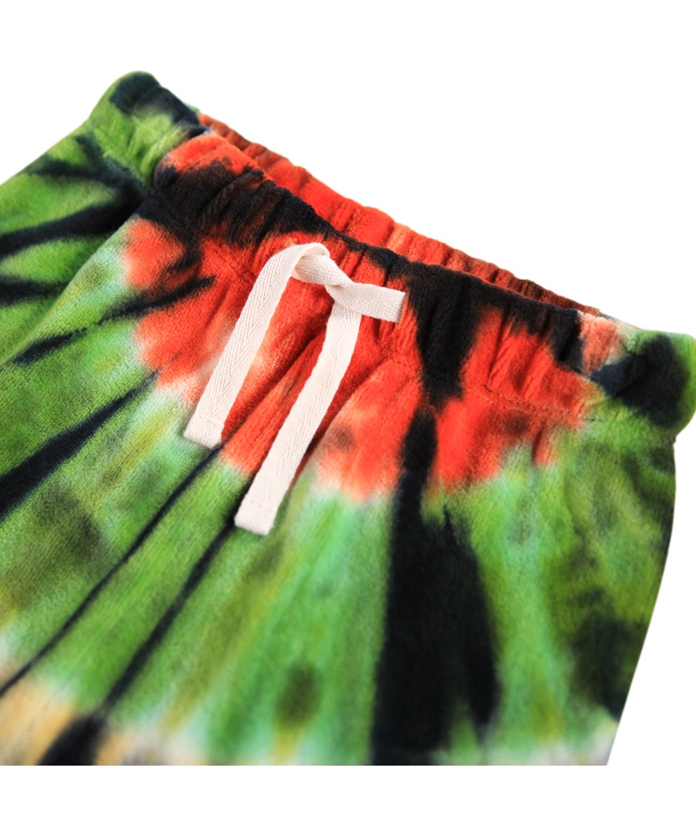 Simeon - Multus Tie Dye - Soft pants for the little ones made of organic velour. The pants have a colourful tie-dye print.