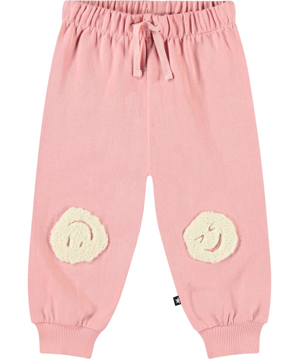 Simeon - Rosequartz - Soft pants in organic cotton for baby. The pants are pink with soft smiling faces.
