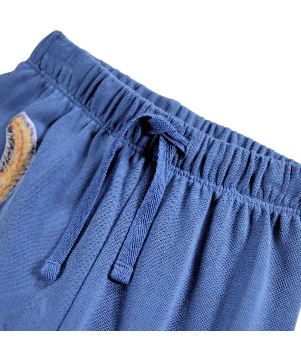 Simeon - Shallow Sea - Soft blue pants for the little ones made of organic cotton with print of squirrels.