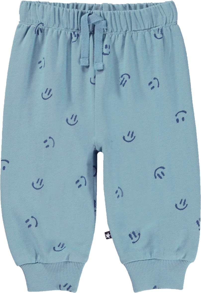 Simeon - Simply Happy - Blue organic baby trousers with a smiley face print