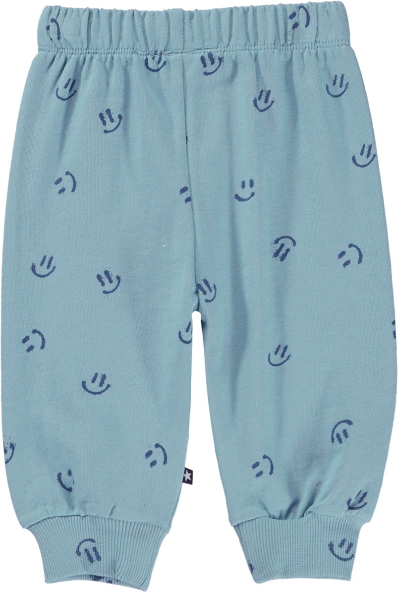 Simeon - Simply Happy - Blue organic baby trousers with a smiley face print