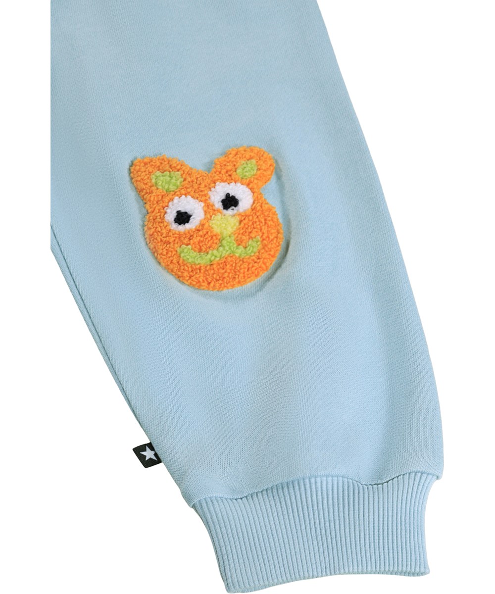 Simeon - Stream - Soft, blue sweatpants for the little ones made of organic cotton with funny knee patches