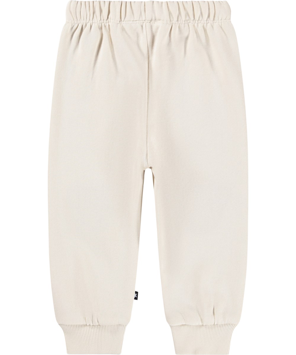 Simeon - White Noise - Soft pants for the little ones made of organic cotton. The pants are off-white with soft brown teddy bears on the knees.