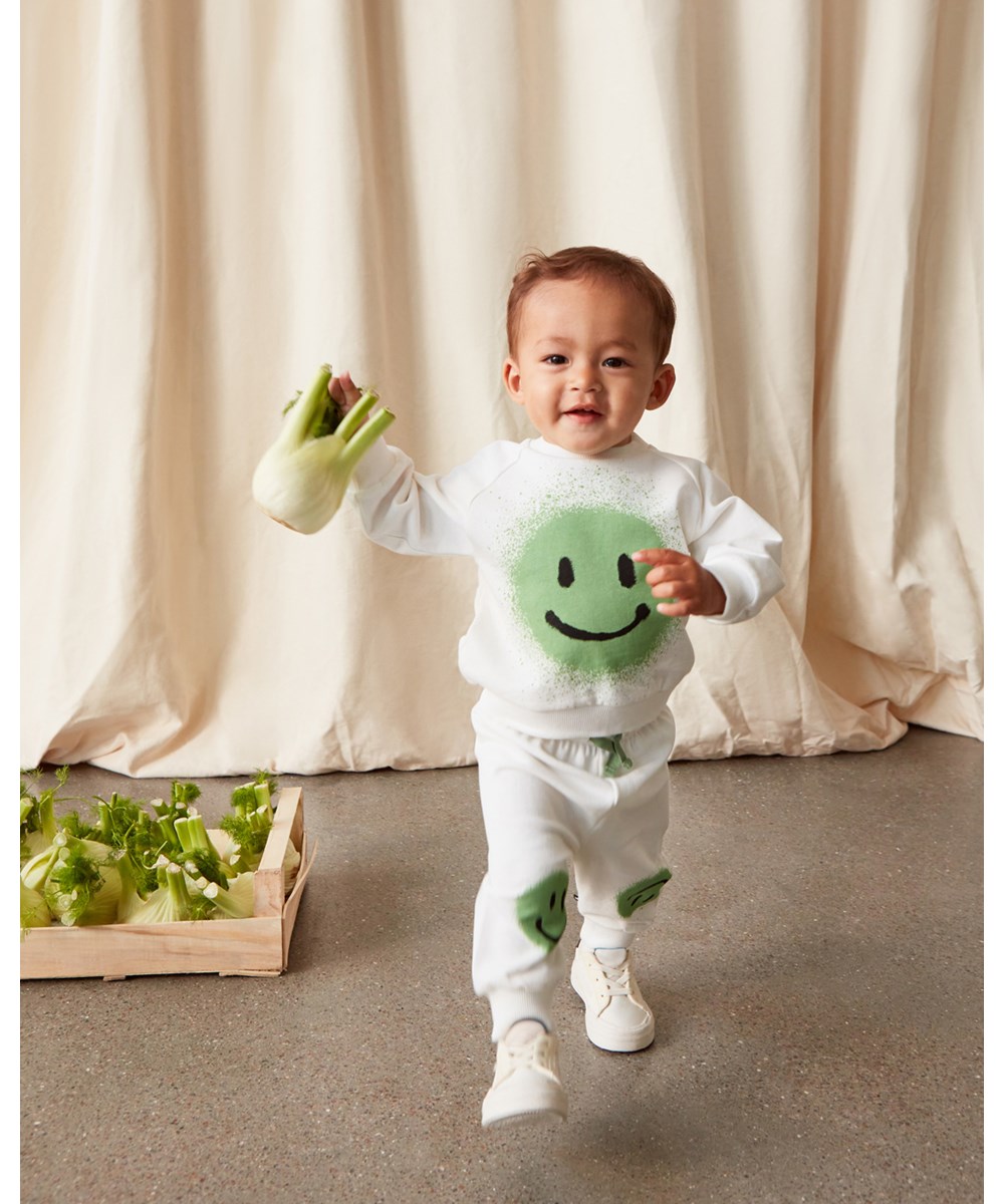 Simeon - White Star - White baby sweatpants with green smiley faces