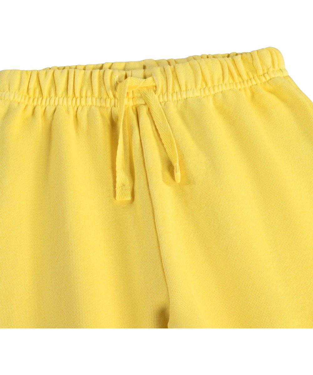 Simon - Sunshine - Soft, yellow sweatpants for the little ones made of organic cotton with a music print 