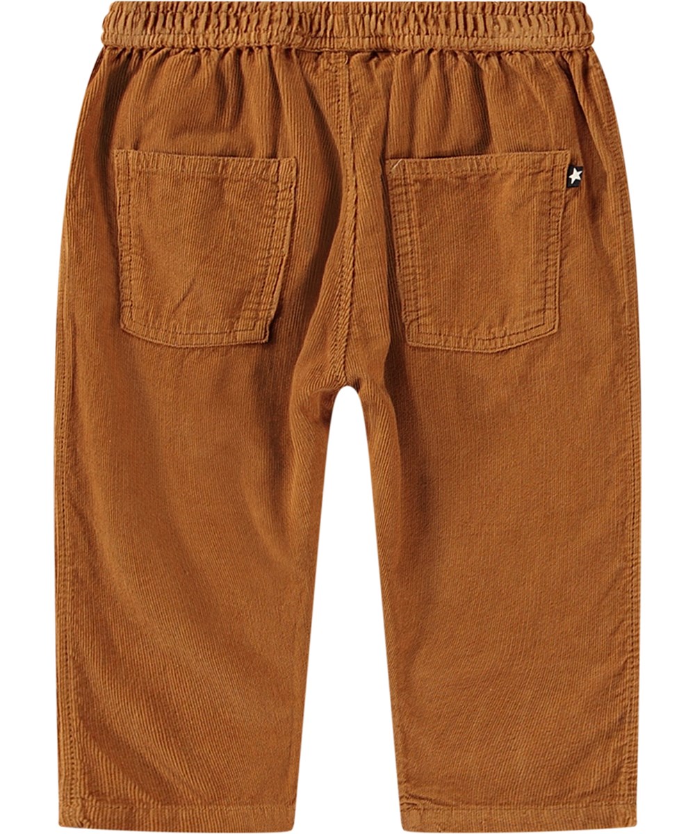 Sois - Brown Sugar - Orange organic cotton baby trousers with loose fit and elastic waistband.