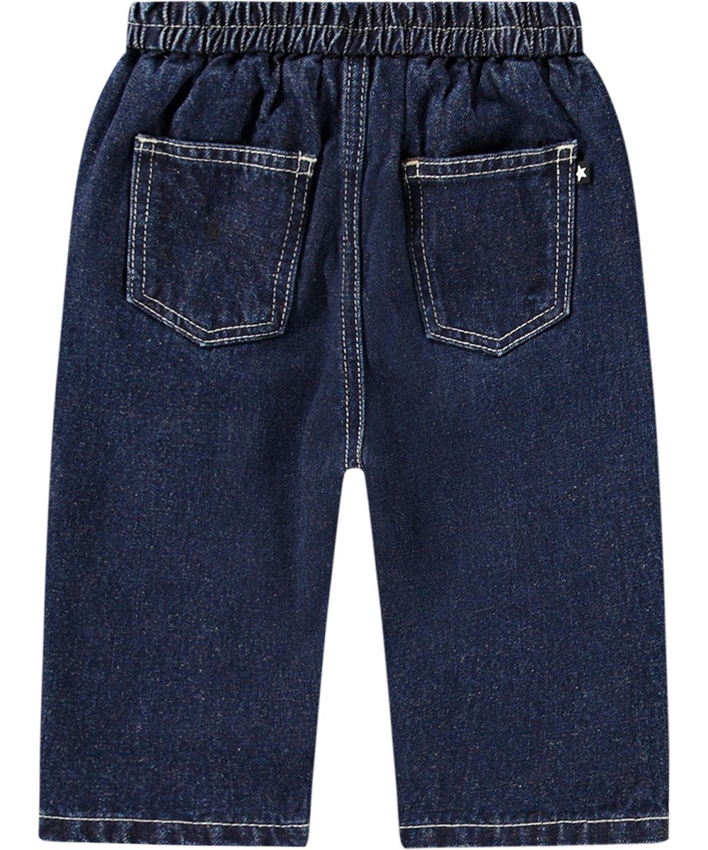 Sois - Oceanic Denim - Blue denim trousers for kids with loose fit, elastic waist, and pockets. Lightweight and airy with embroidered smiling face.