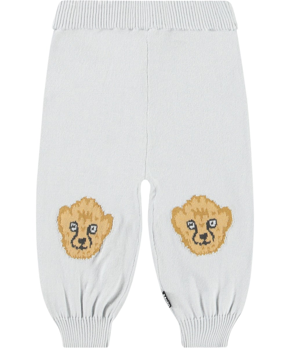 Sol - Skywriting - Knitted pants in organic cotton for baby. Knitted in light blue decorated with cute cheetah cubs on the knees.