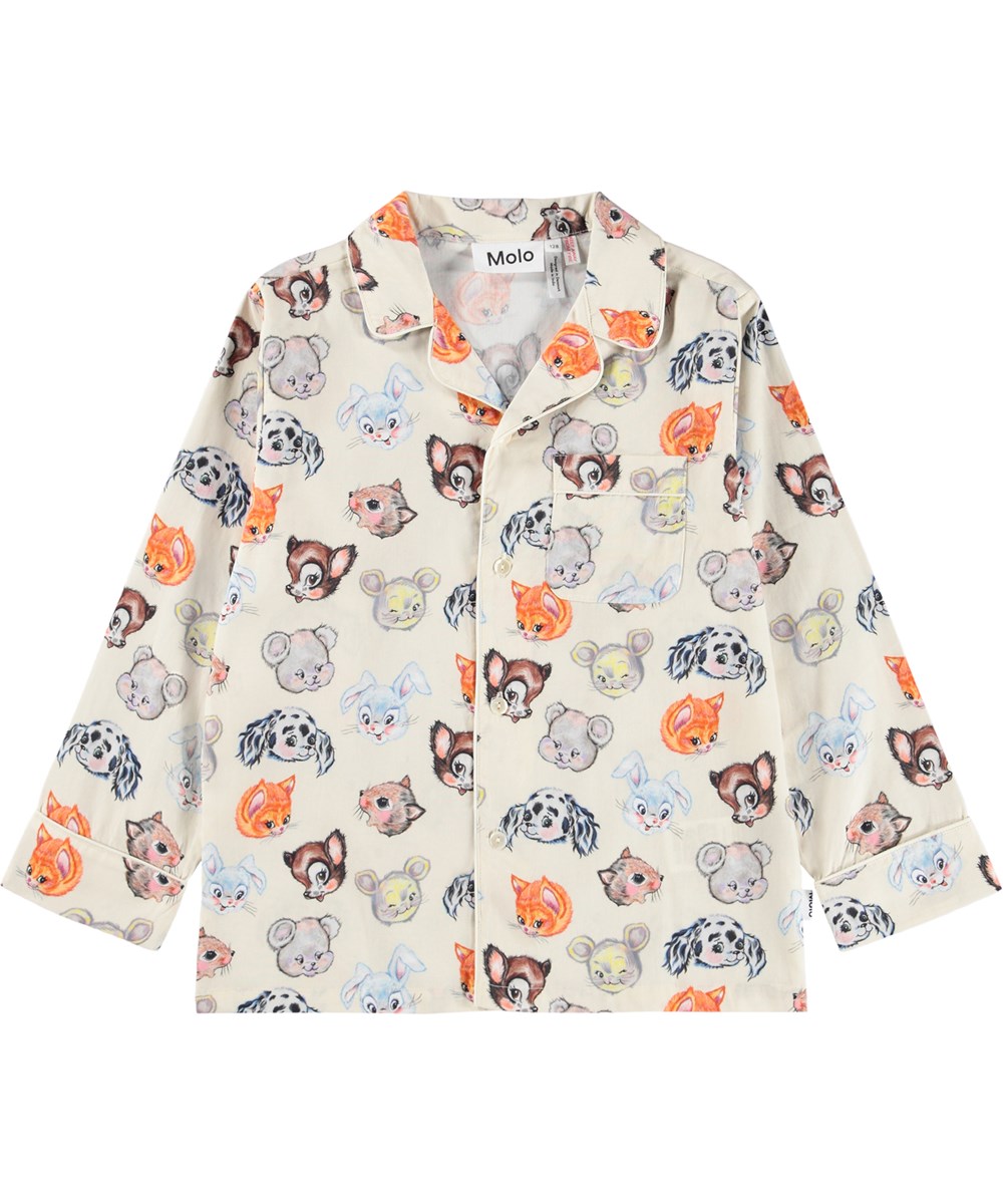 Lex - Itty Bitty Cream - Pyjama-Set in Off-White für Kinder aus Öko-Baumwolle mit einem Druck von niedlich gezeichneten Tieren.