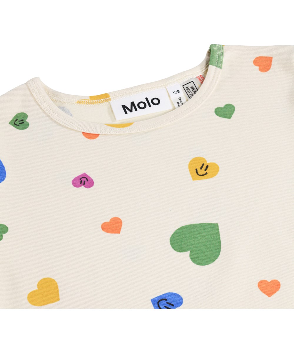 Lou US - Confetti Smiles - Beige zweiteilige Kinderpyjamas aus Bio-Baumwolle mit Herzmuster
