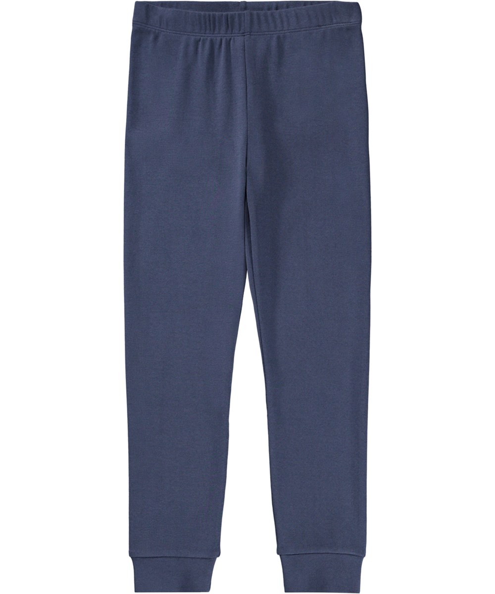 Lue - Galaxy Blue - Dunkelblaues Pyjama-Set für Kinder aus Öko-Baumwolle mit einem weiß aufgesprühten Lächeln.