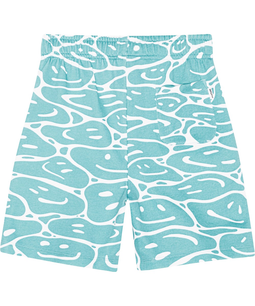 Adian - Waves Of Joy - Shorts in turquoise and white in organic cotton jersy with an all over print of smiling faces