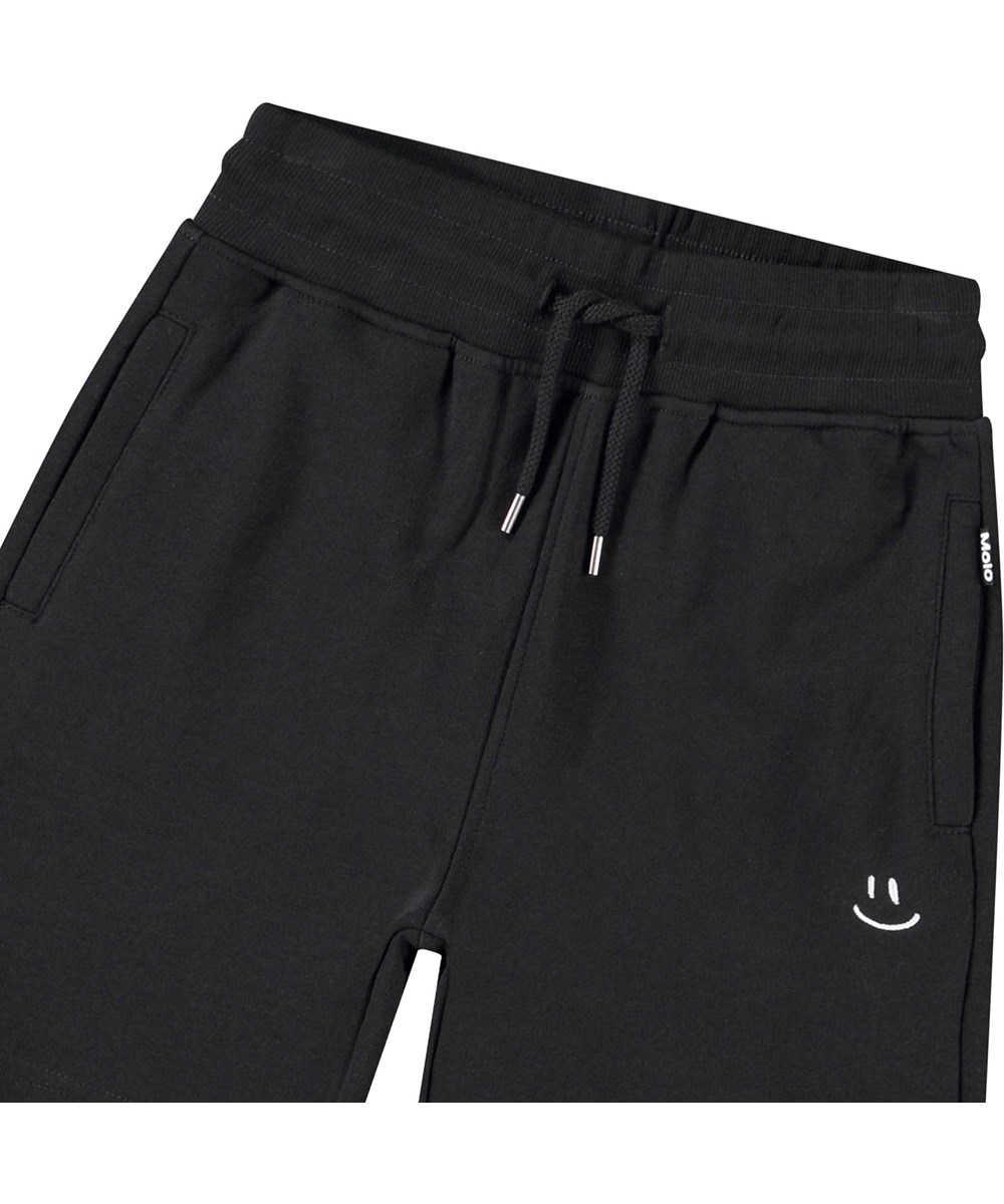 Alw - Black - Black shorts in organic cotton with a white smiling face for children.
