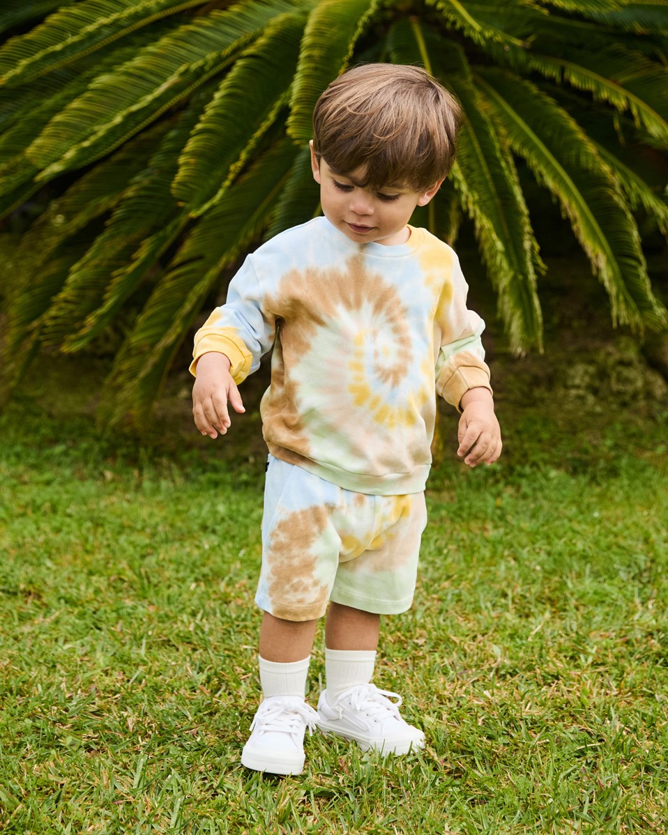 Simms - Tie Dye Swirl - Soft organic cotton shorts for baby. They are in a multicoloured tie-dye with an embroidered smiling face.