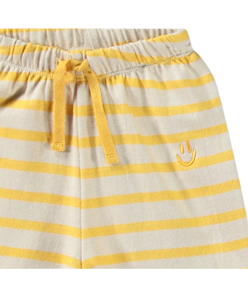 Skie - Mimosa Stripe - Soft organic cotton shorts for babies with yellow and beige stripes.