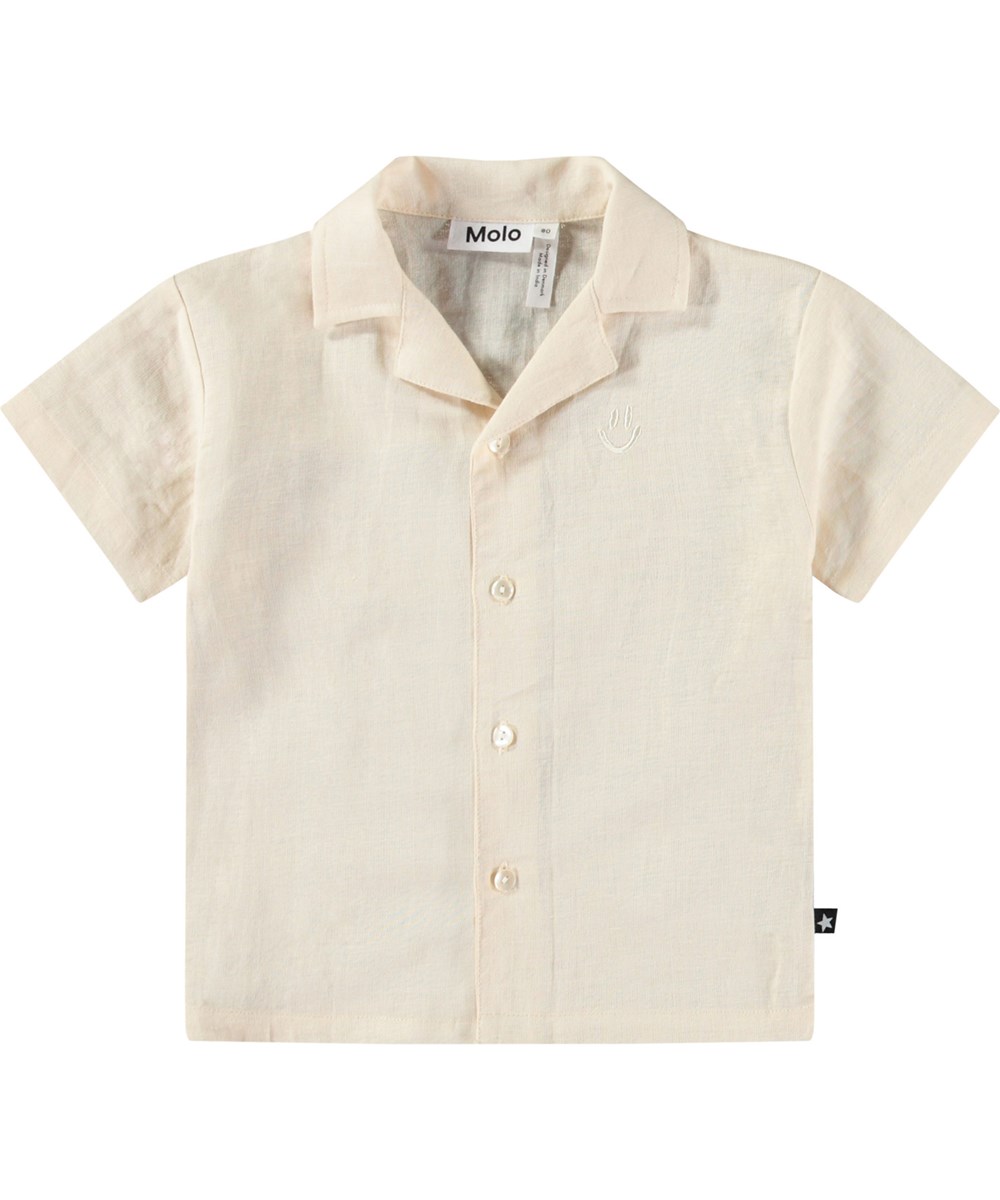Eyou - Summer Sand - Kortærmet skjorte i økologisk bomuld til baby. Skjorten er beige med broderet smilende ansigt.