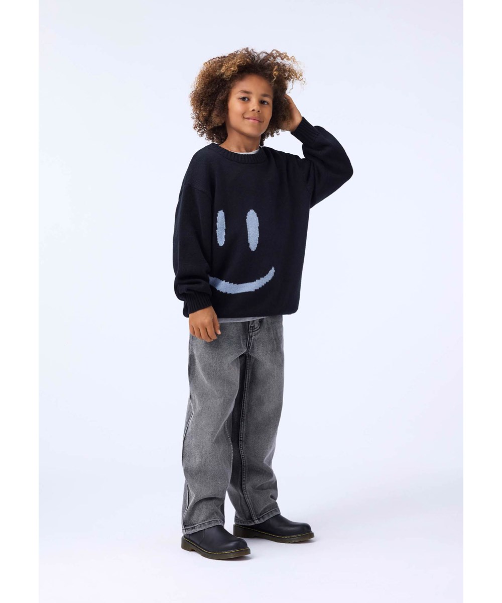 Bello - Smile Smile - Black knitted sweater for children made of a wool and cotton blend with a smiling face.