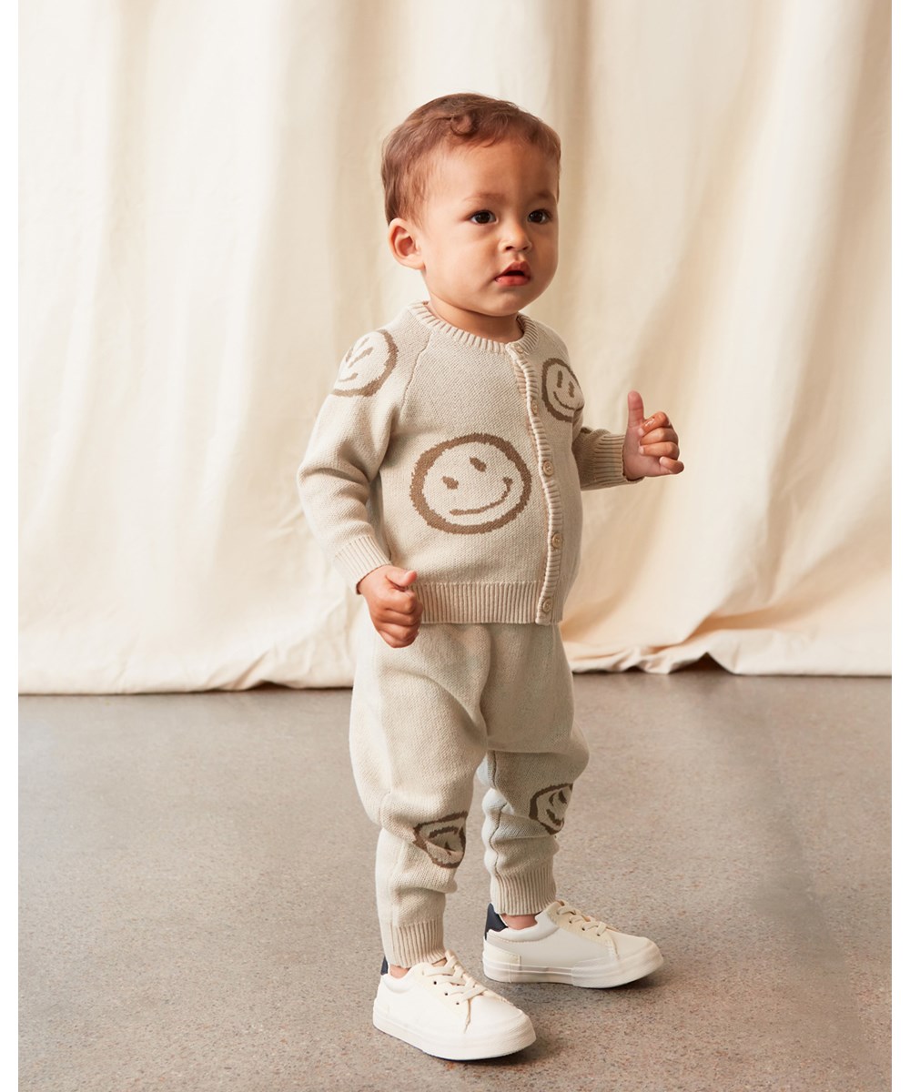 Brody - Overcast - Baby knit cardigan in beige with smiley faces