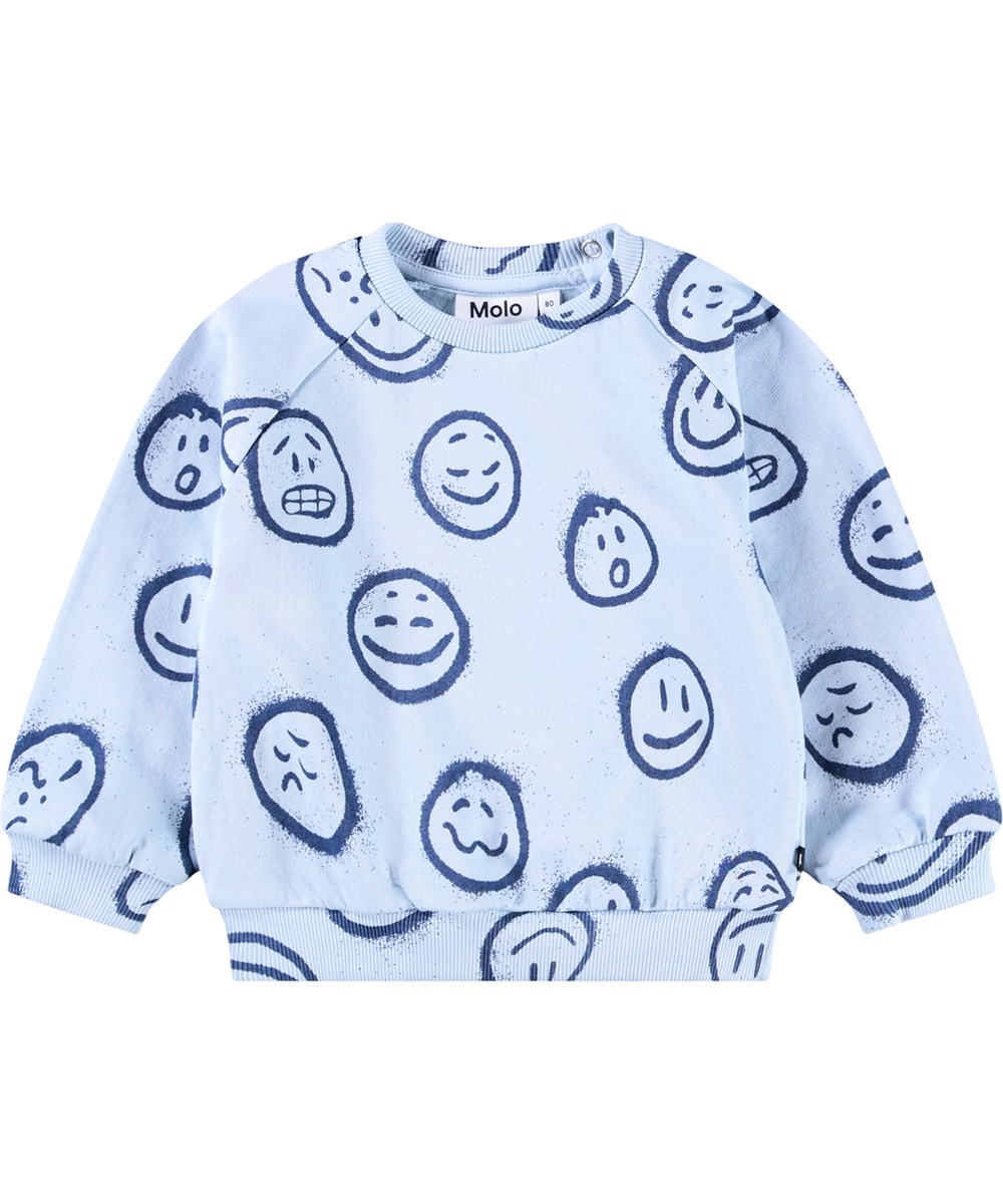Disc - Blue Moon Moods - Light blue sweatshirt for the little ones made of soft organic cotton with a print of faces in different moods.