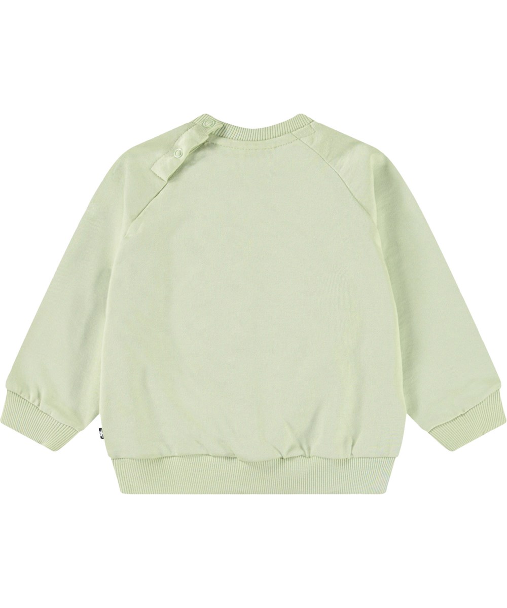 Disc - Misty Green - Organic light green baby sweatshirt with a soft smiling face.