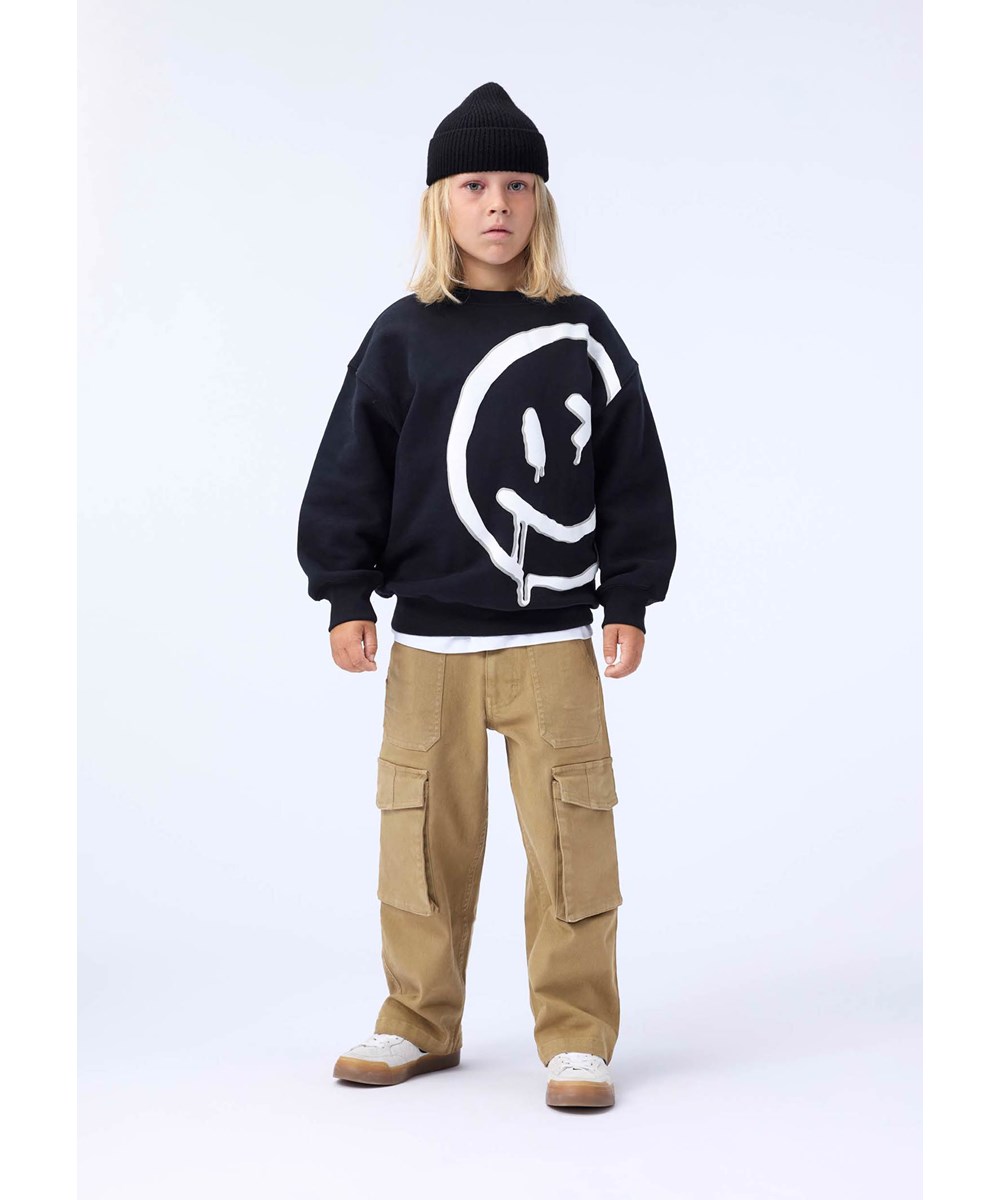 Mar - Drippy White - Black sweatshirt for children made of soft organic cotton with a large smiling face.