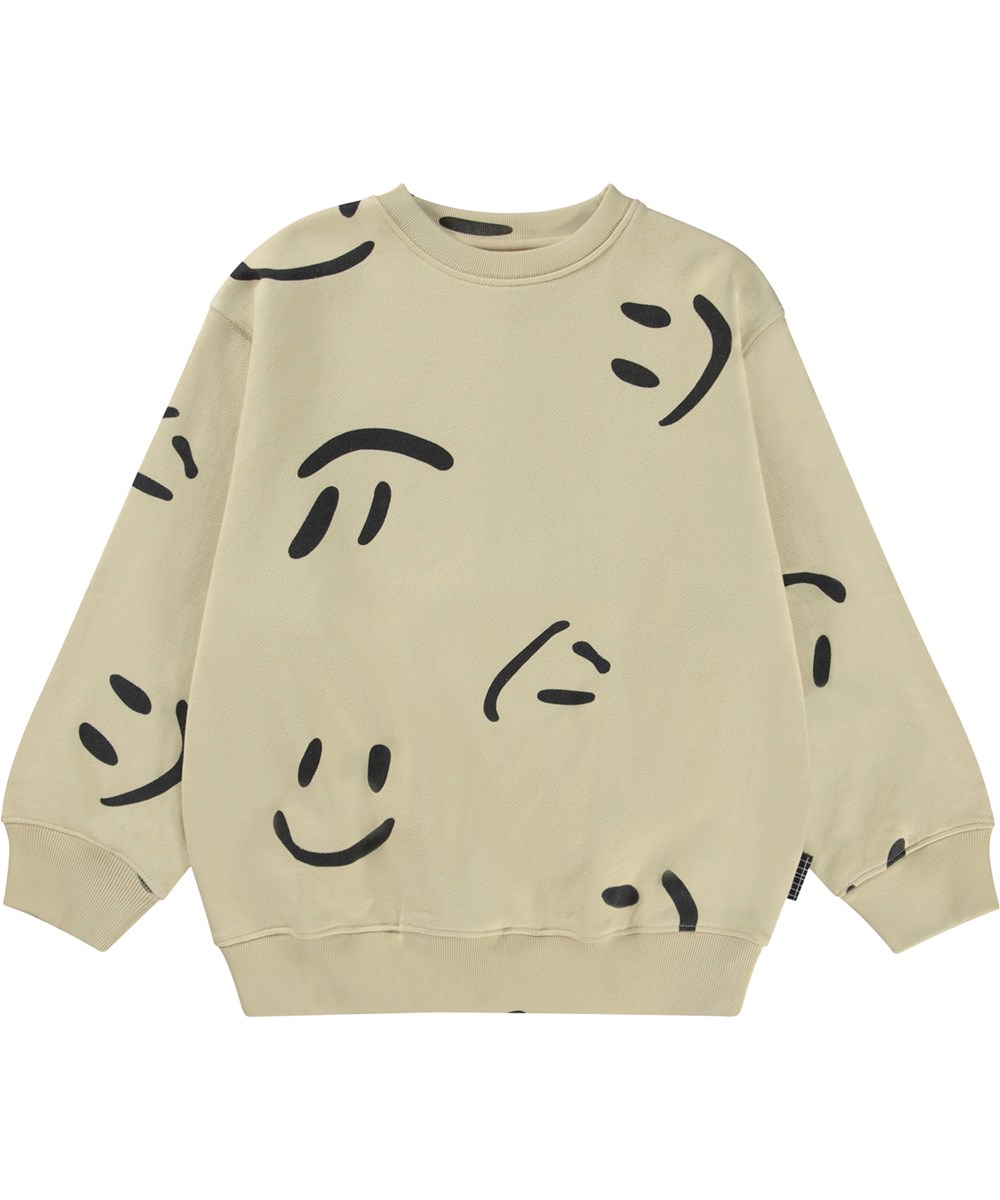 Monti - Big Smiles - Beige organic sweatshirt with a black all over smiley face print