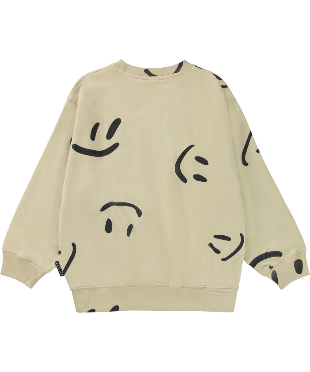 Monti - Big Smiles - Beige organic sweatshirt with a black all over smiley face print