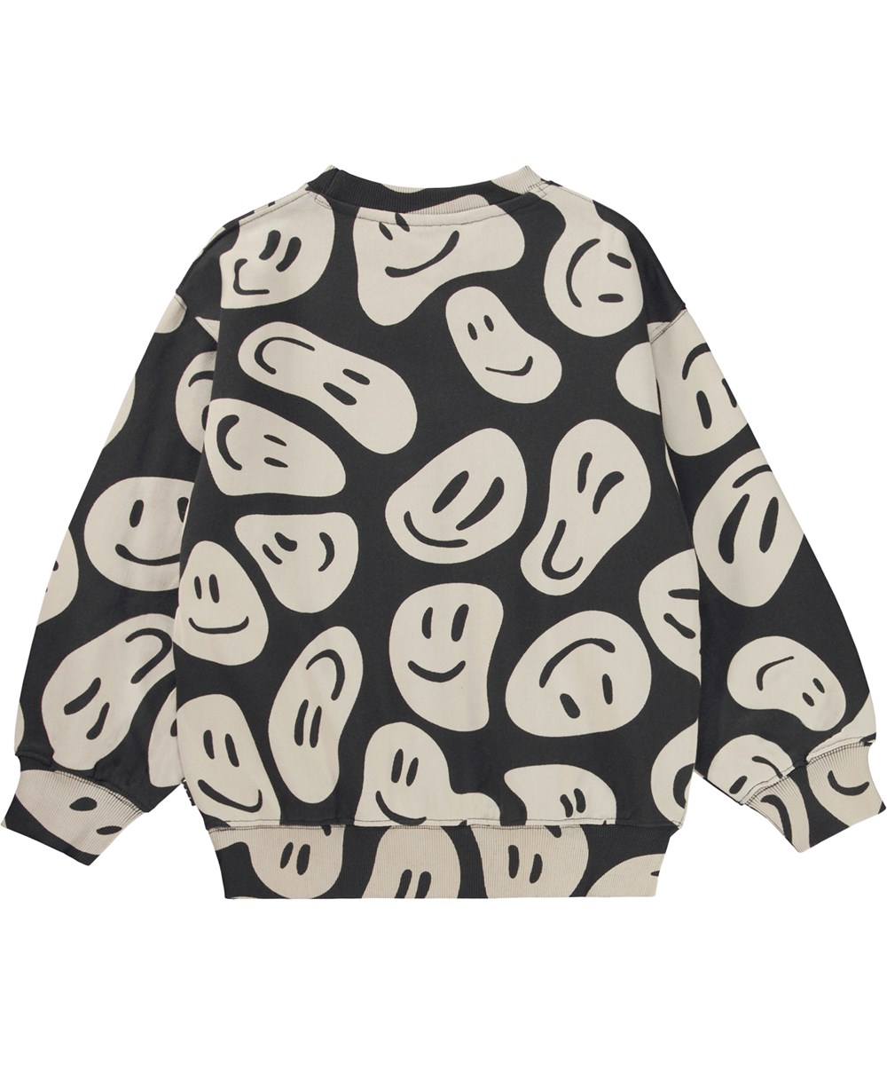 Monti - Smile On Black - Black organic sweatshirt with beige all over print