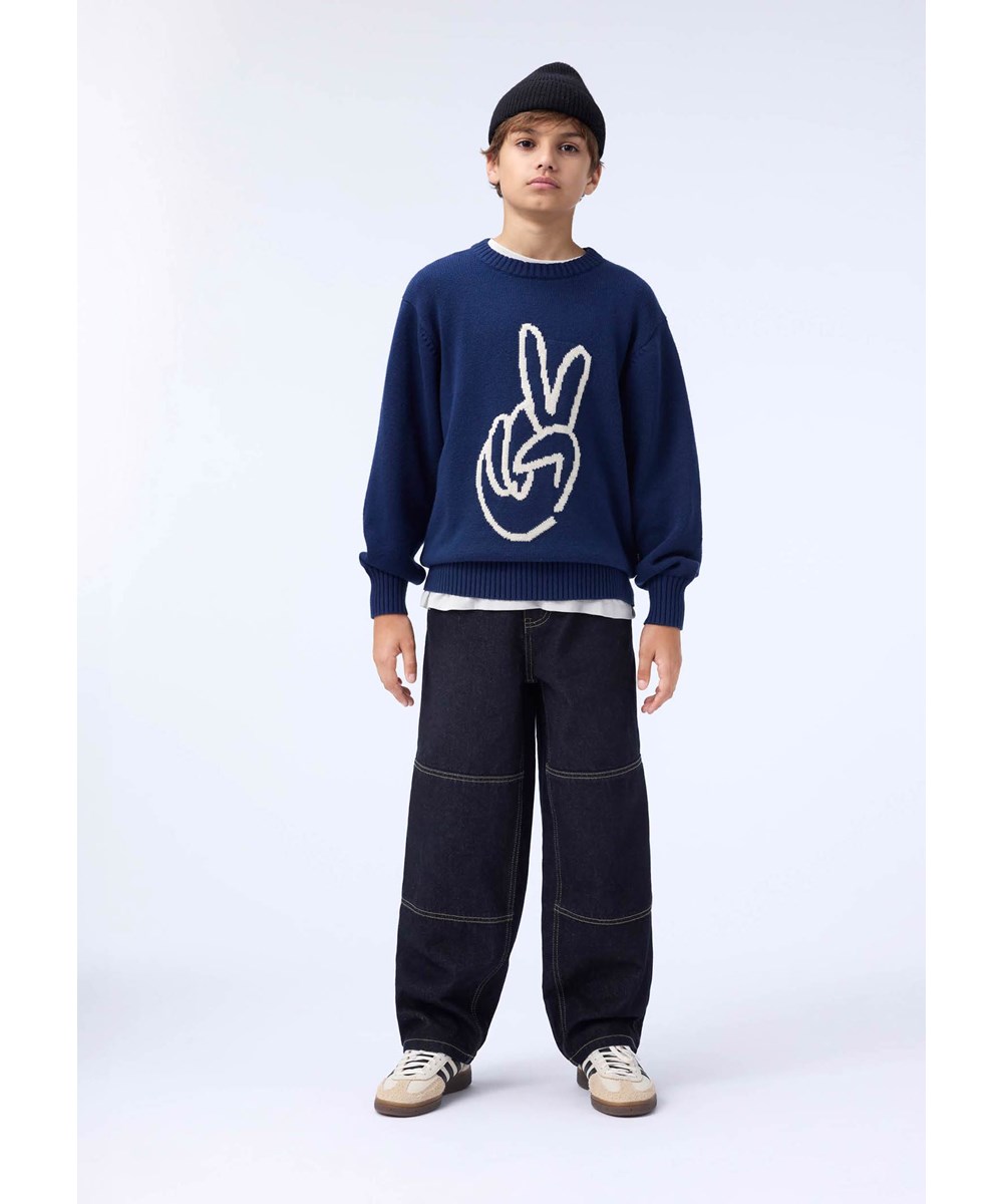 Bello - Peace At Hand - Dunkelblauer Strickpullover für Kinder aus einer Mischung aus Wolle und Baumwolle mit einem Friedenszeichen.