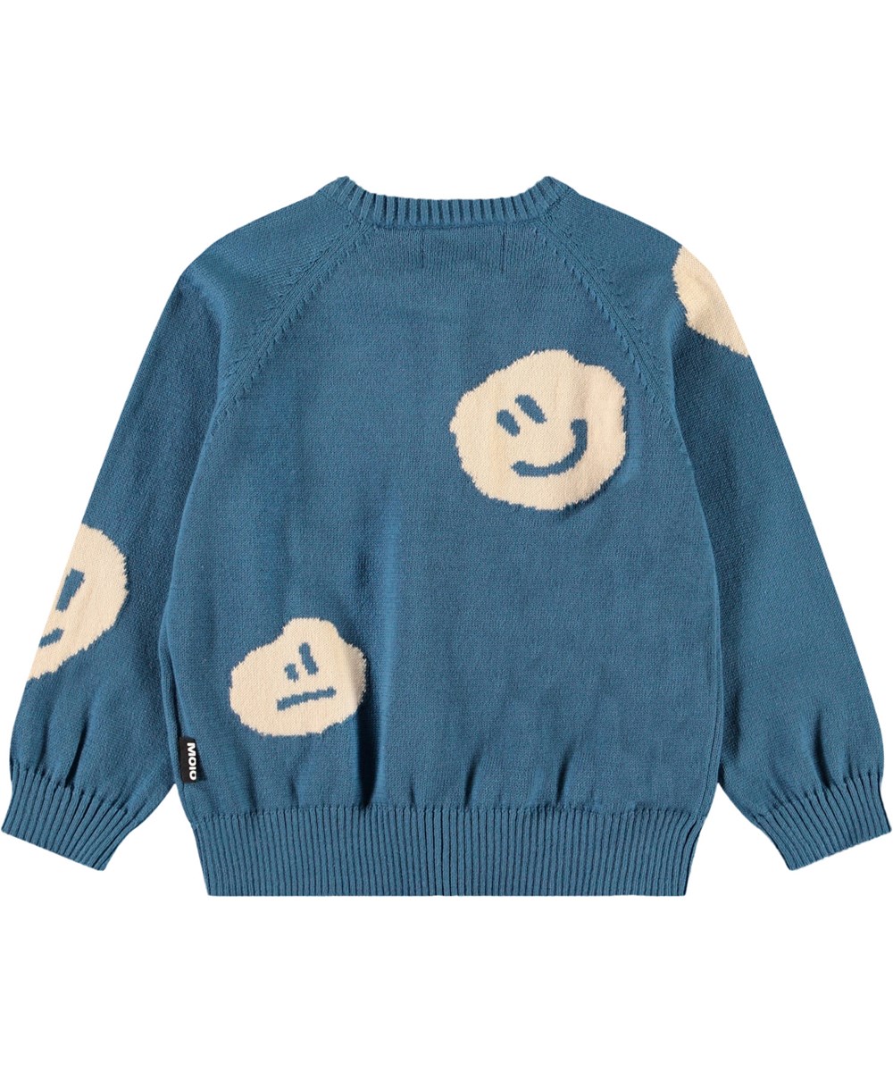 Brody - Lagoa - Strickjacke für Babys aus weicher Öko-Baumwolle. Die Strickjacke ist blau mit fröhlichen Gesichtern.