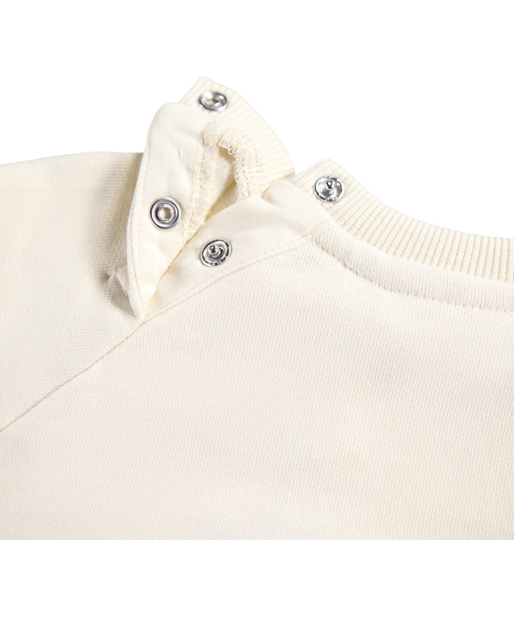 Disc - Blue Bird - Off-White Sweatshirt für die Kleinen aus weicher Öko-Baumwolle mit einem Aufdruck eines blauen Vogels auf der Vorderseite.