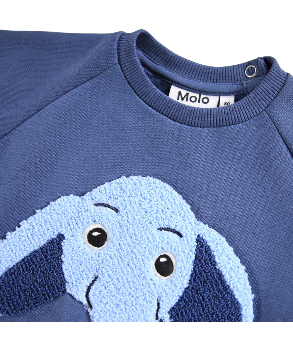 Disc - Toy Elephant - Blaues Sweatshirt für die Kleinen aus weicher Öko-Baumwolle mit einem gestickten Elefanten-Gesicht auf der Vorderseite.