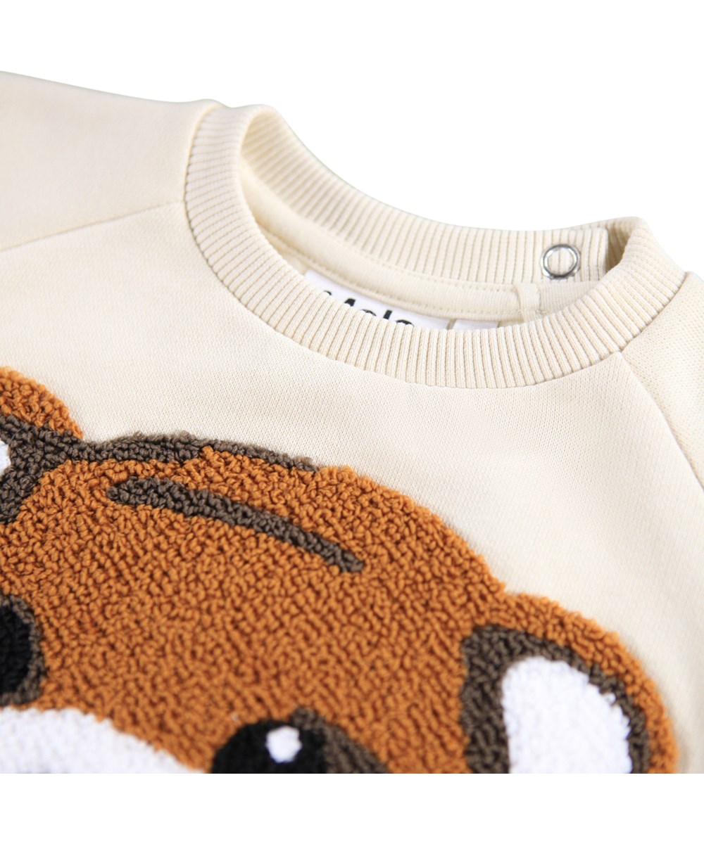 Disc - White Noise - Off-White-Sweatshirt für die Kleinen aus weicher Öko-Baumwolle mit einem gestickten Teddybären-Gesicht auf der Vorderseite.
