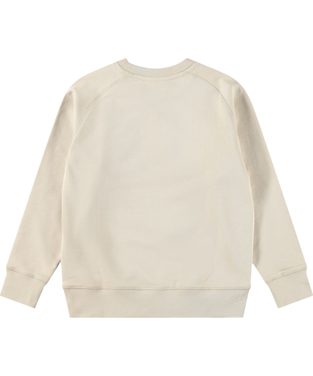 Mike - Summer Sand - Beiger Kinderpullover aus Bio-Baumwolle mit einem lächelnden Stickmotiv