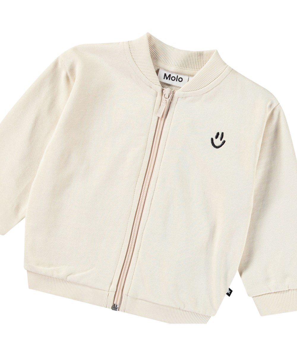 Dazzle - Summer Sand - Witte babysweater met rits van biologisch katoen.