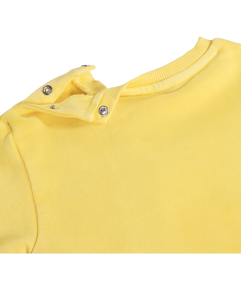 Dear - Sunshine - Zachte, gele sweatshirt voor de kleintjes gemaakt van biologisch katoen met een muziekprint.