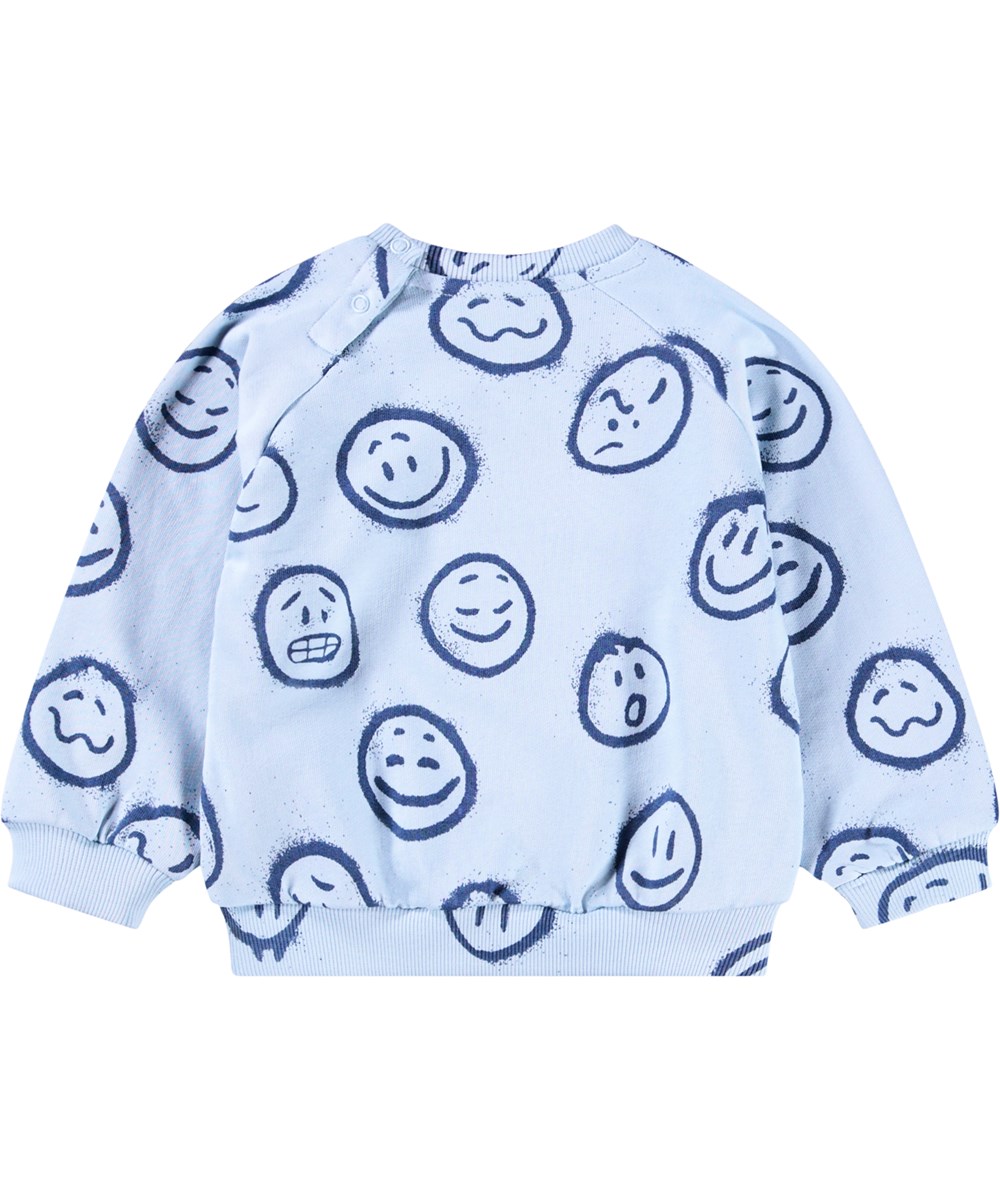 Disc - Blue Moon Moods - Lichtblauwe sweater voor de kleintjes gemaakt van zacht biologisch katoen met een print van gezichten in verschillende stemmingen.