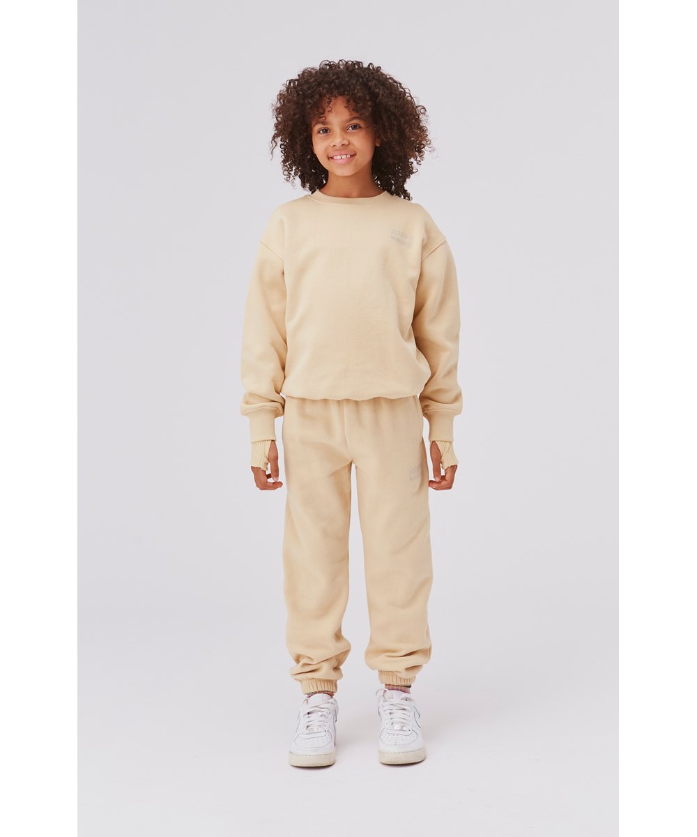 Memphis - Starlight - Lichtgele biologische unisex sweater