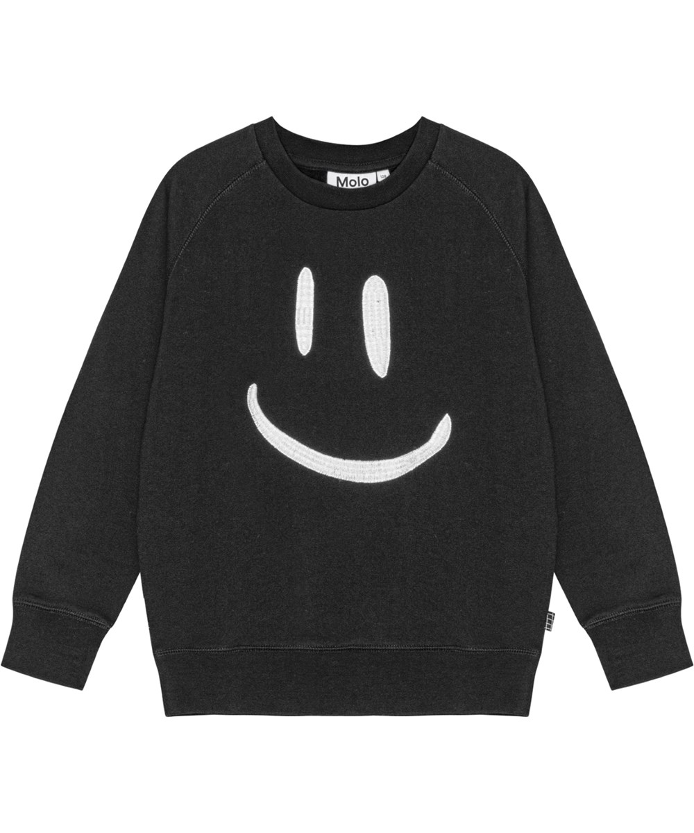 Mike - Black - Molo x Plan International biologisch katoenen sweater in het zwart met een geborduurde smiley op de voorkant.