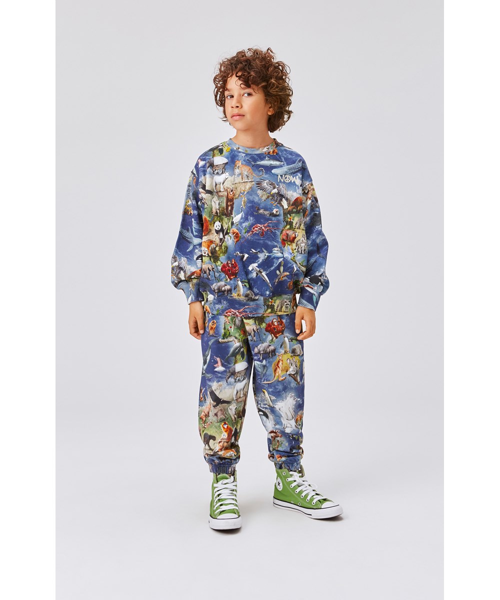 Monti - Amazing Earth - Unisex blauwe trui met dierenprint