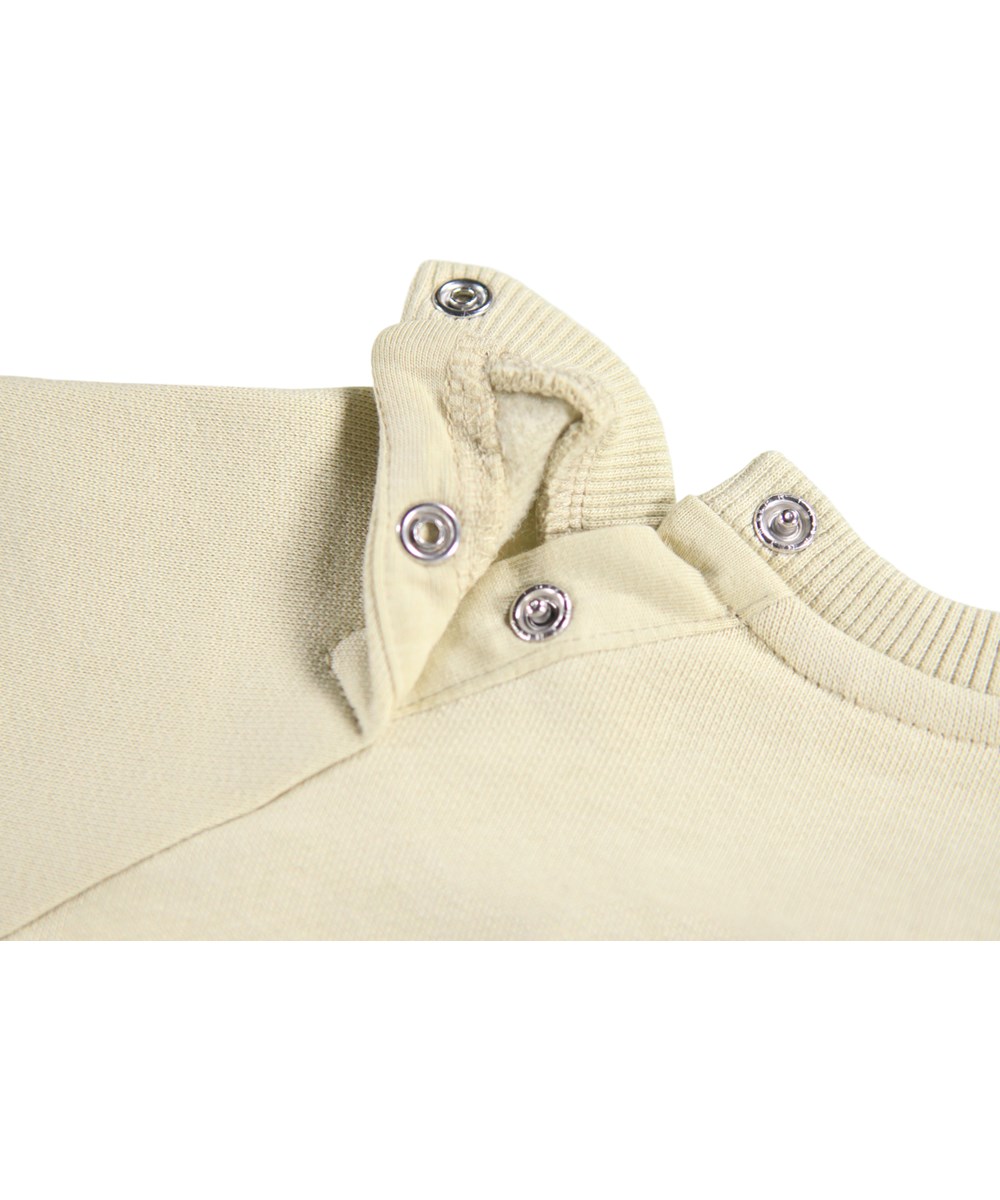 Disc - Doggy Portrait - Beige sweatshirt til de mindste i blødt økologisk bomuld med et hunde print på fronten.